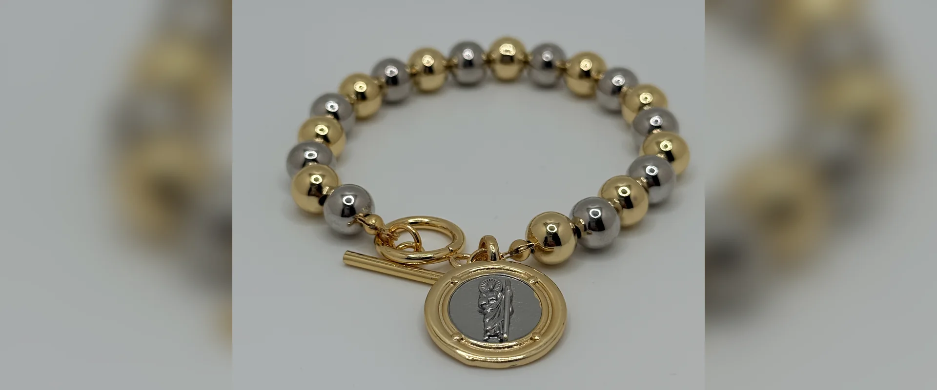 Beaded bracelet with Saint Benedict medal and toggle clasp