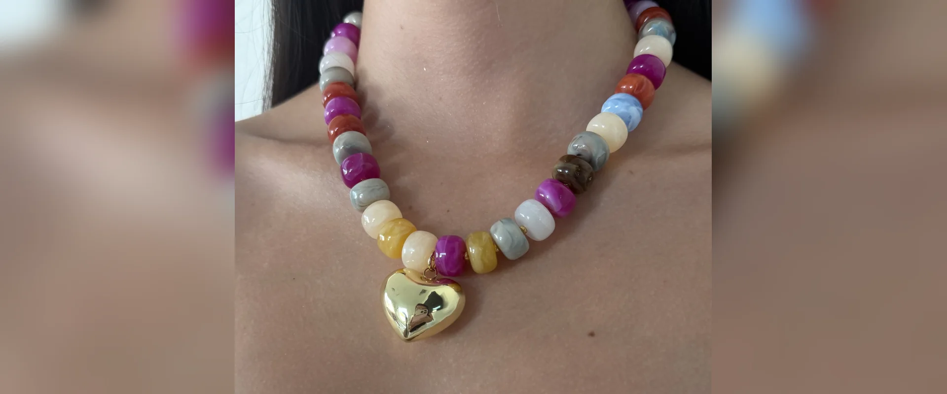 Colorful bead necklace with gold heart