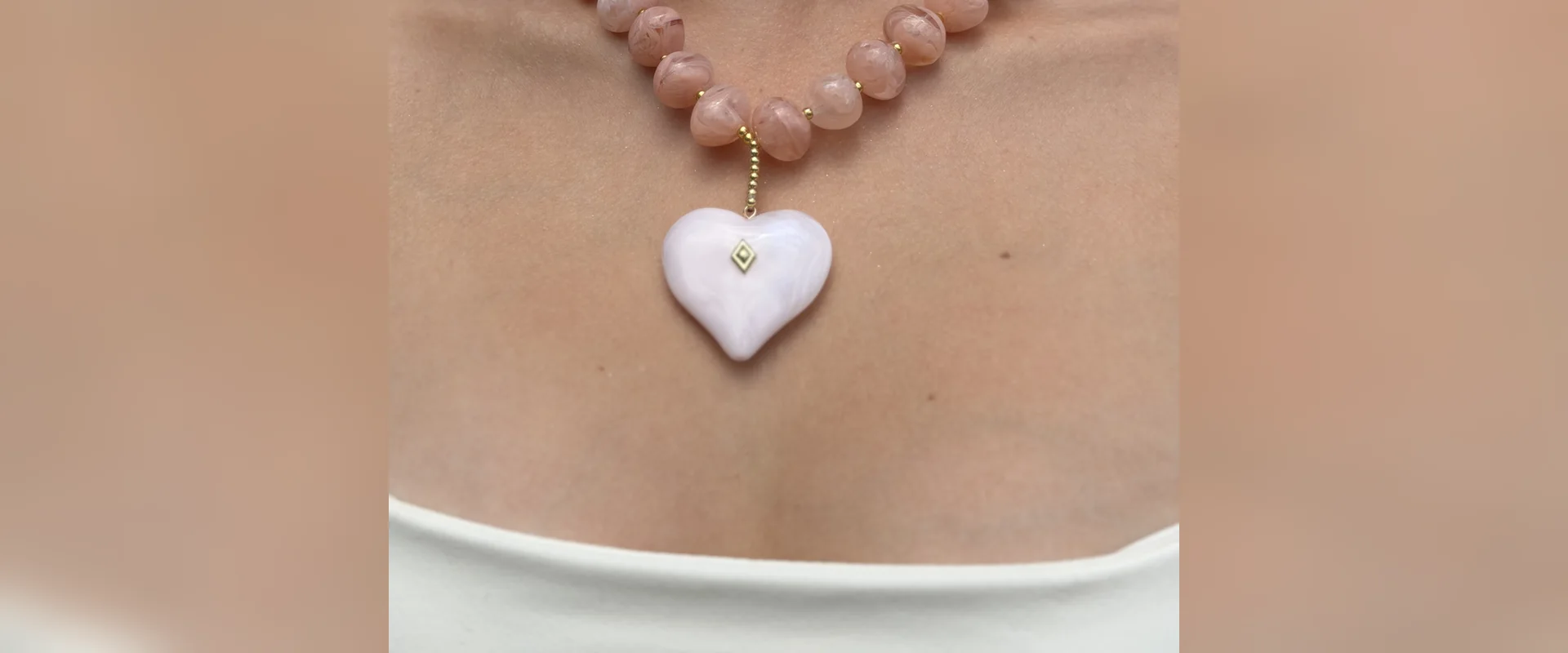Pink pearl necklace with pearly heart